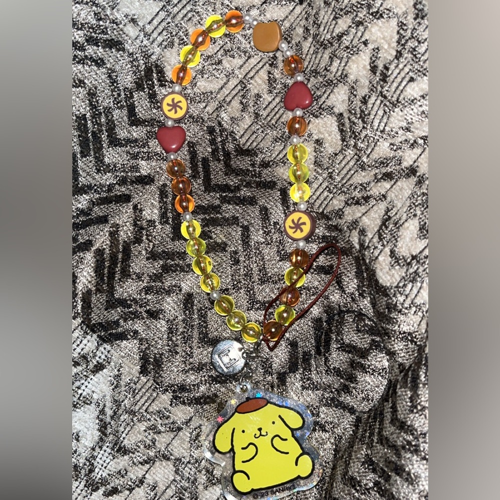 Sanrio Pompompurin phone charm